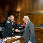 Linsey Graham and Chief Casstevens shaking hands