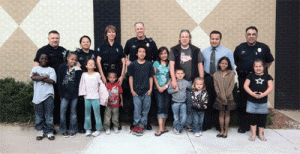Law enforcement advocates pose with the children of clients.