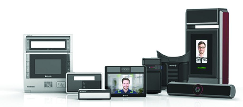 Biometric security devices displayed on a white background, including iris scanners, facial recognition terminals, cameras, monitors, and access‑control modules arranged in a product lineup.