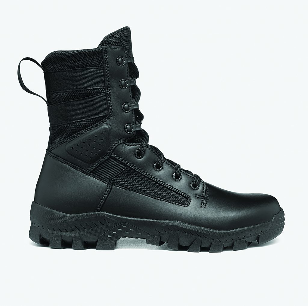 a single black tactical boot designed for law enforcement professionals. The boot features a high ankle with padded support and six pairs of eyelets for laces, along with two additional hooks at the top for secure fastening. The upper part of the boot is made from a combination of leather and mesh fabric, providing durability and breathability. There is a pull tab at the back of the ankle for easy wearing. The midsole appears to be cushioned, offering comfort during extended wear. The outsole has deep treads, ensuring strong grip and traction on various surfaces.