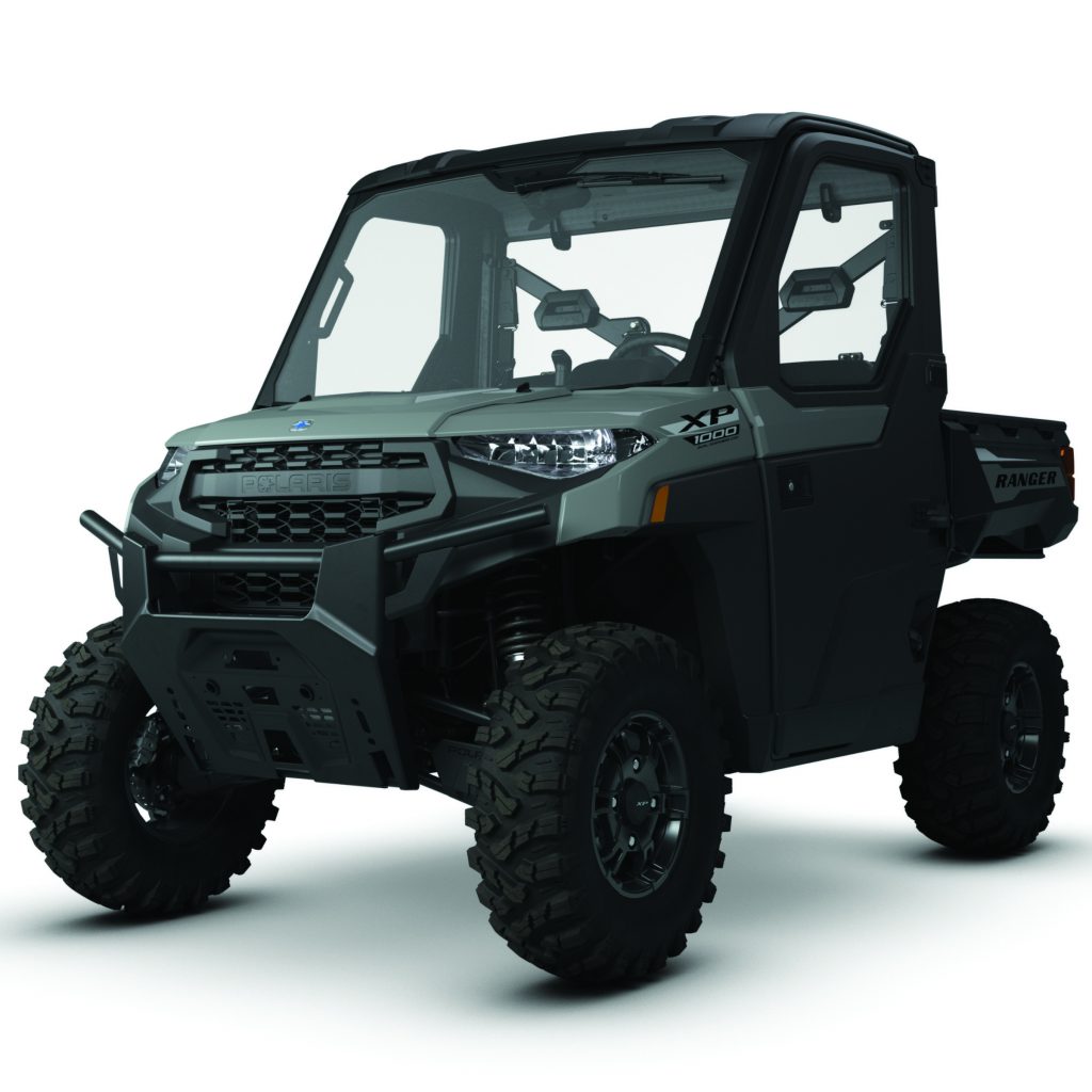 Cabbed four door off road UTV with enclosed windshield, roll cage, rugged tires, front bumper, and cargo bed shown on a white background rendering CGI