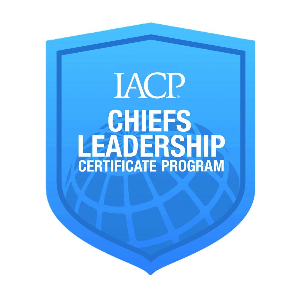 Blue shield logo with IACP text and globe graphic, displaying Chiefs Leadership Certificate Program wording centered within layered border emblem icon