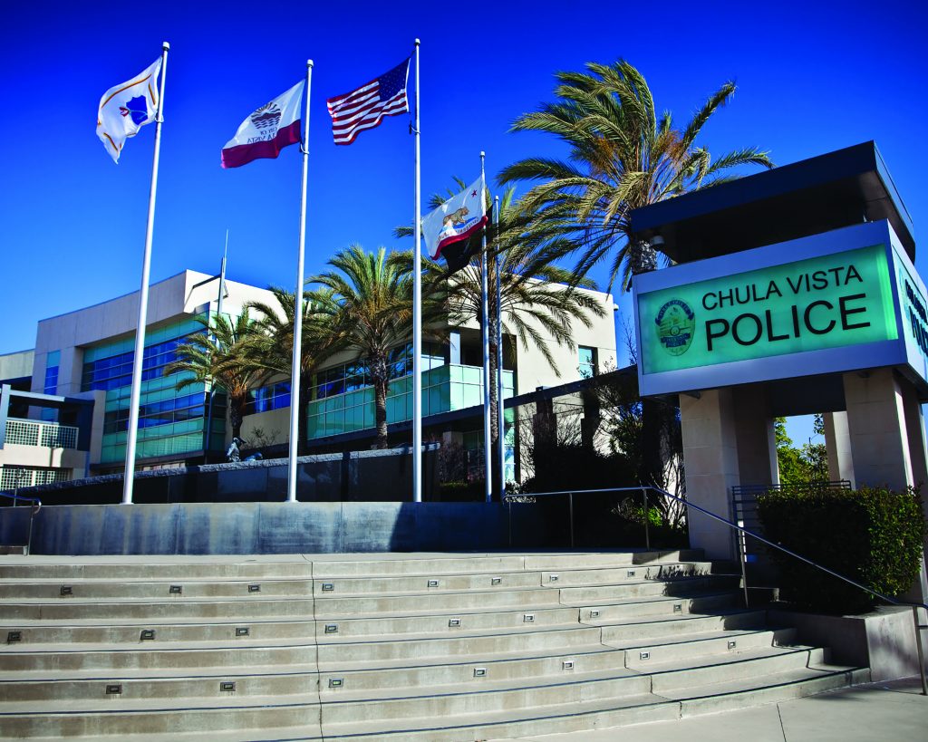 Station for Chula Vista, California, with mountains and trees in the background.