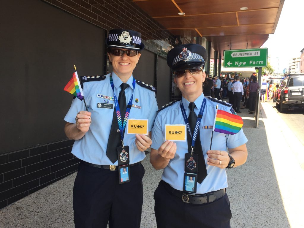 Celebrate Inclusion - photo of officers at the Brisbane Pride Festival promoting 'R U OK? Day'.