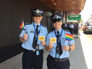 Celebrate Inclusion - photo of officers at the Brisbane Pride Festival promoting 'R U OK? Day'. 
