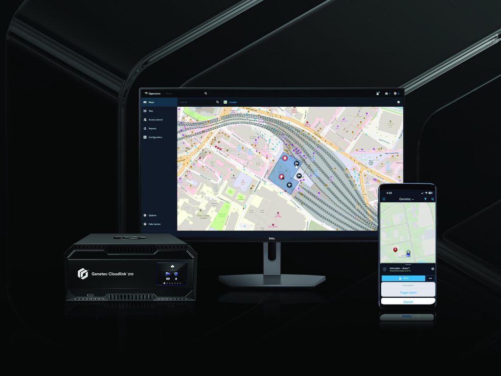 Front of a modern building, ensuring facilities security. The officer is dressed in uniform and equipped with a radio and other security gear.