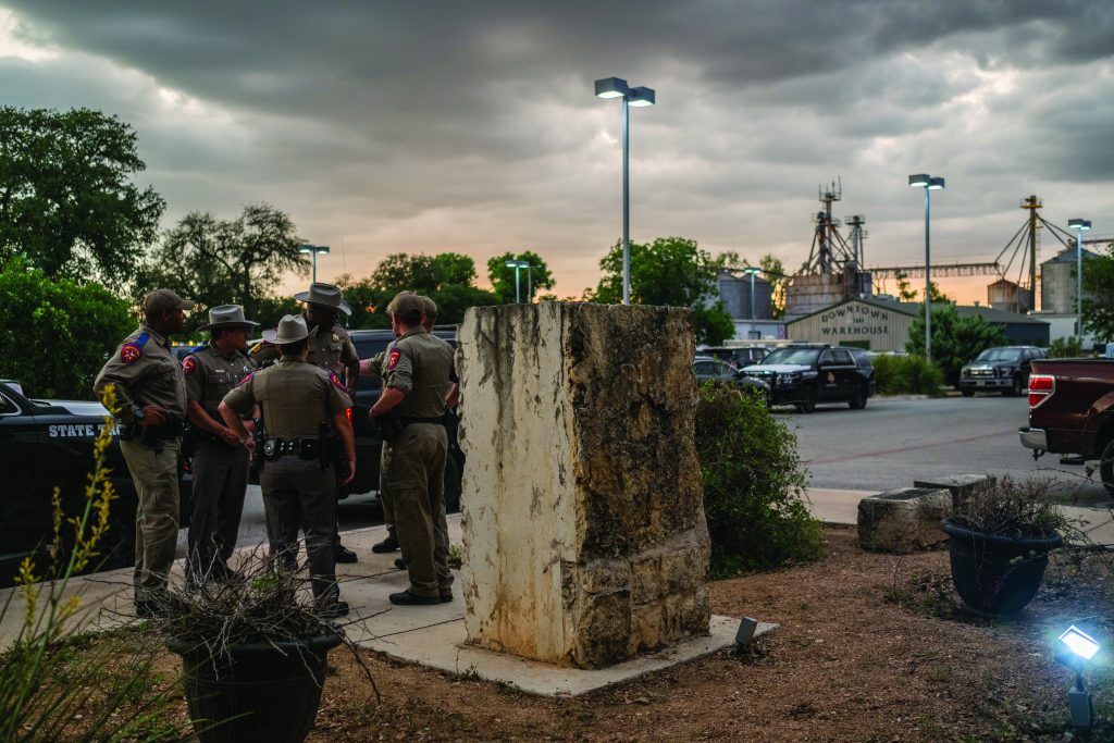 UVALDE, TEXAS - MAY 24: Law enforcement officers speak together outside of the SSGT Willie de Leon Civic Center following the mass shooting at Robb Elementary School on May 24, 2022 in Uvalde, Texas. According to reports, 19 students and 2 adults were killed, with the gunman fatally shot by law enforcement. (Photo by Brandon Bell/Getty Images)