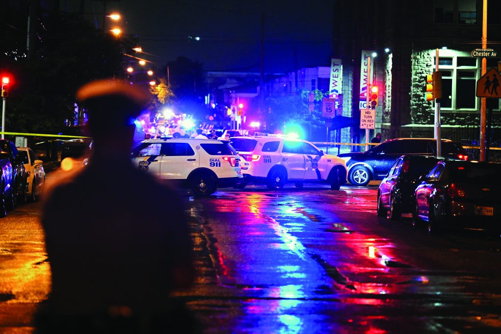 PHILADELPHIA, PENNSYLVANIA - JULY 3: Police work the scene of a shooting on July 3, 2023 in Philadelphia, Pennsylvania. Early reports say the suspect is in custody after shooting 6 people in the Kingsessing section of Philadelphia on July 3rd.