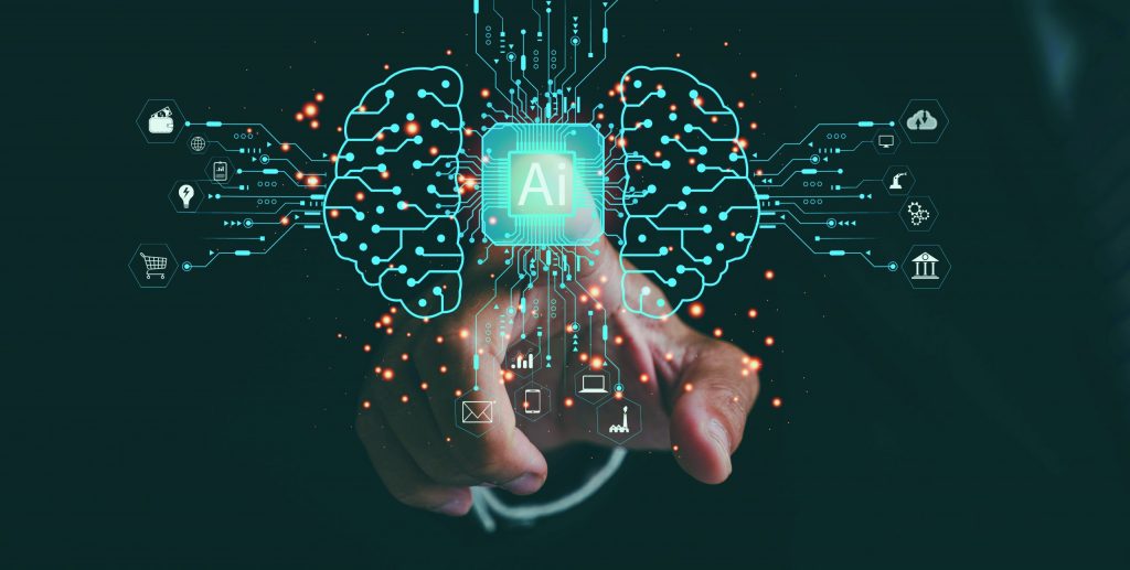 Hand points at glowing “AI” icon amid digital brain graphics and tech symbols for data, cloud, security, and communication on dark background