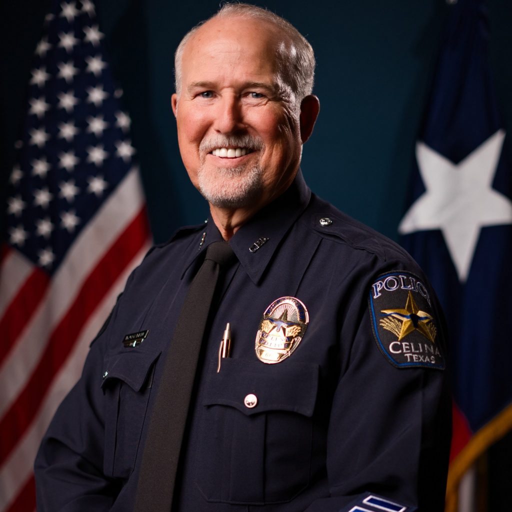 Uniformed officer stands before U.S. and Texas flags; shoulder patch reads “Police Celina Texas” with star emblem, highlighting department identity.