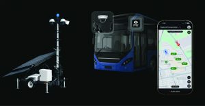 Surveillance trailer with solar panels and multiple cameras stands beside a bus graphic and security app interface displaying map alerts, connected via ZeroEyes system
