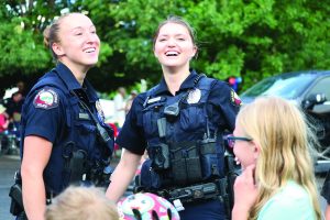 Two laughing female officers
