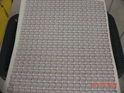 Sheet of counterfeit Michigan cigarette tax stamps. This sheet is one of hundreds, each representing thousands of counterfeit tax stamps.