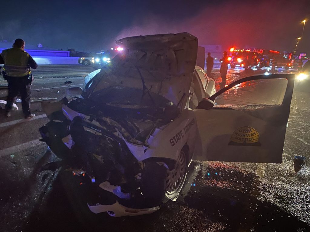 State Trooper car involved in a head on collision with the hood thrown open