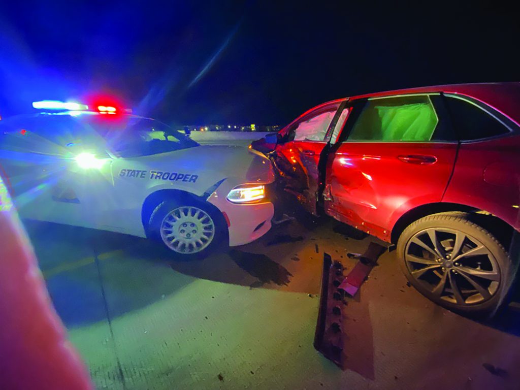 State trooper hitting a red SUV on the driver side