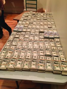 $3.2 million in stacks of one-hundred-dollar bills, seized from a transnational crime group.