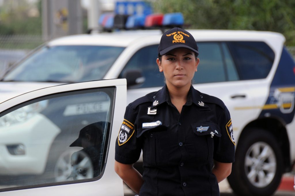 Israel Police Officer and Police Car - Police Chief Magazine
