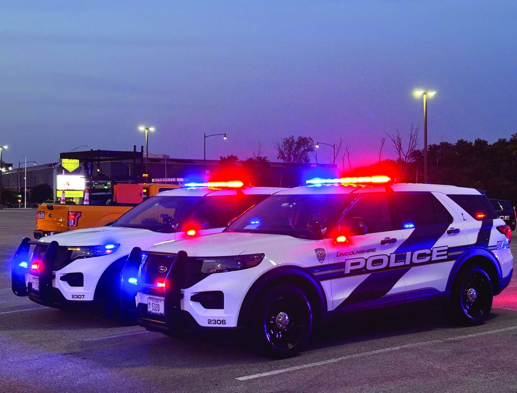 Two Police SUV vehicle with synchronized patrol lights