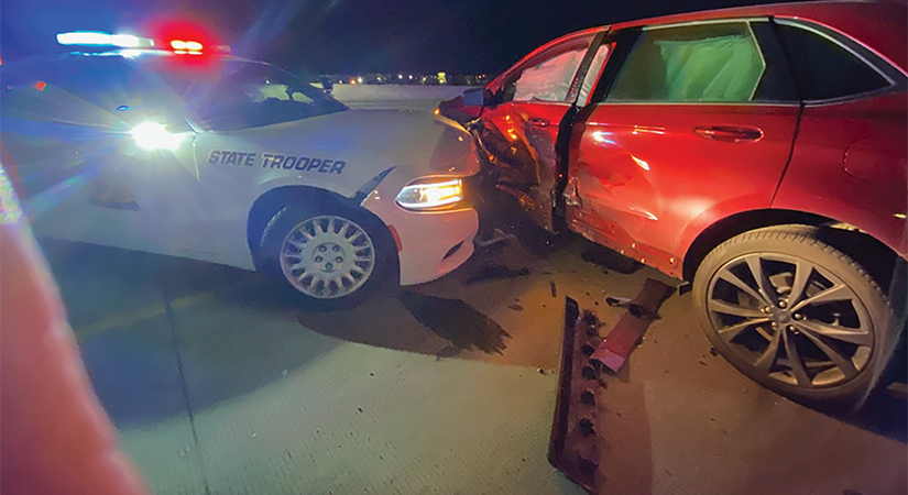 Banner for article showing state trooper hitting the side of red SUV