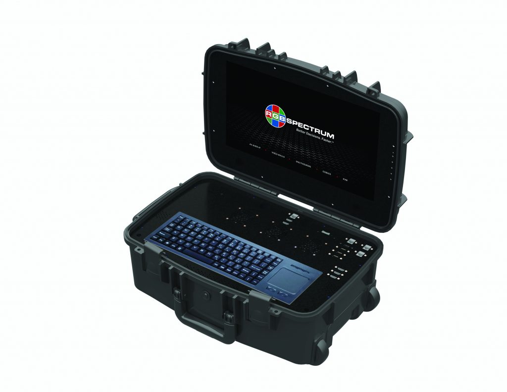 Open black rugged case with built-in keyboard, touchpad, and screen displaying RGB Spectrum logo; multiple ports and buttons visible on case exterior