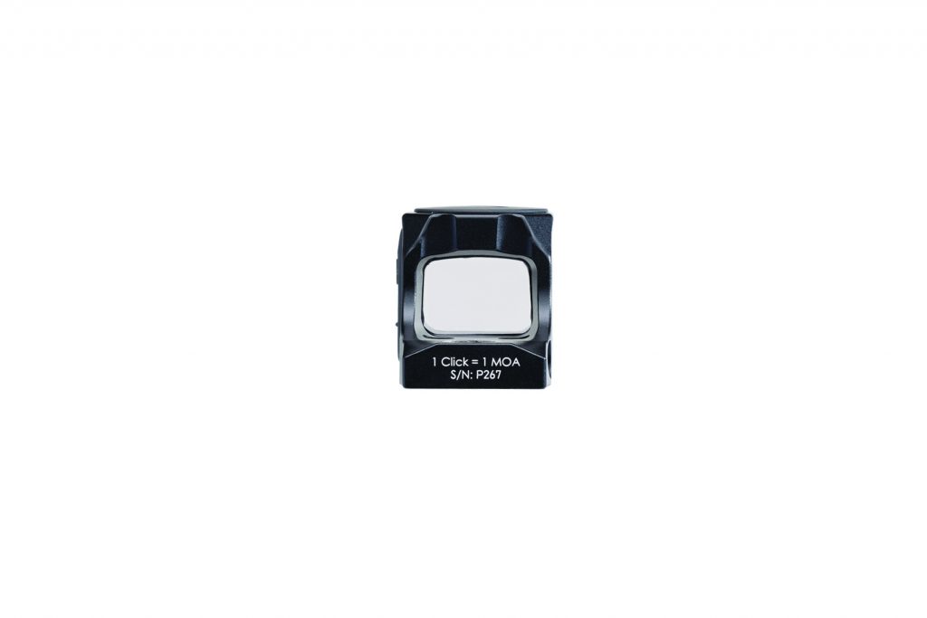 Compact black pistol sight viewed from front shows rectangular lens window, housing edges, and printed text “1 Click = 1 MOA S/N: P267” on base