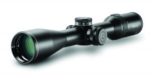 Black HAWKE rifle scope with large objective lens, windage and elevation knobs, and magnification ring; detailed view of tactical optics equipment