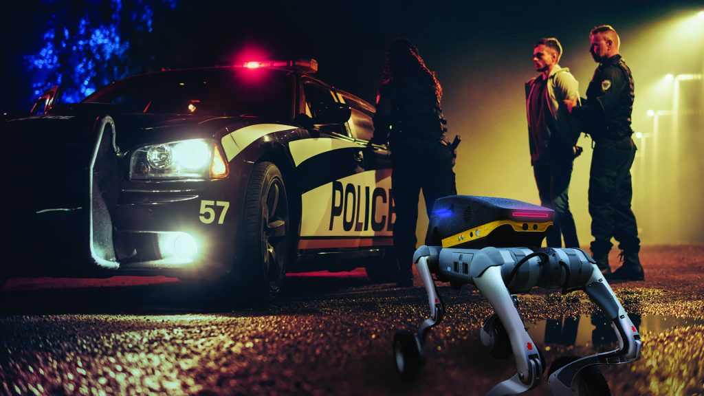 A robotic dog equipped with various sensors and cameras, standing on a flat surface. The robotic dog is designed for advanced surveillance and operational tasks, showcasing cutting-edge technology in robotics