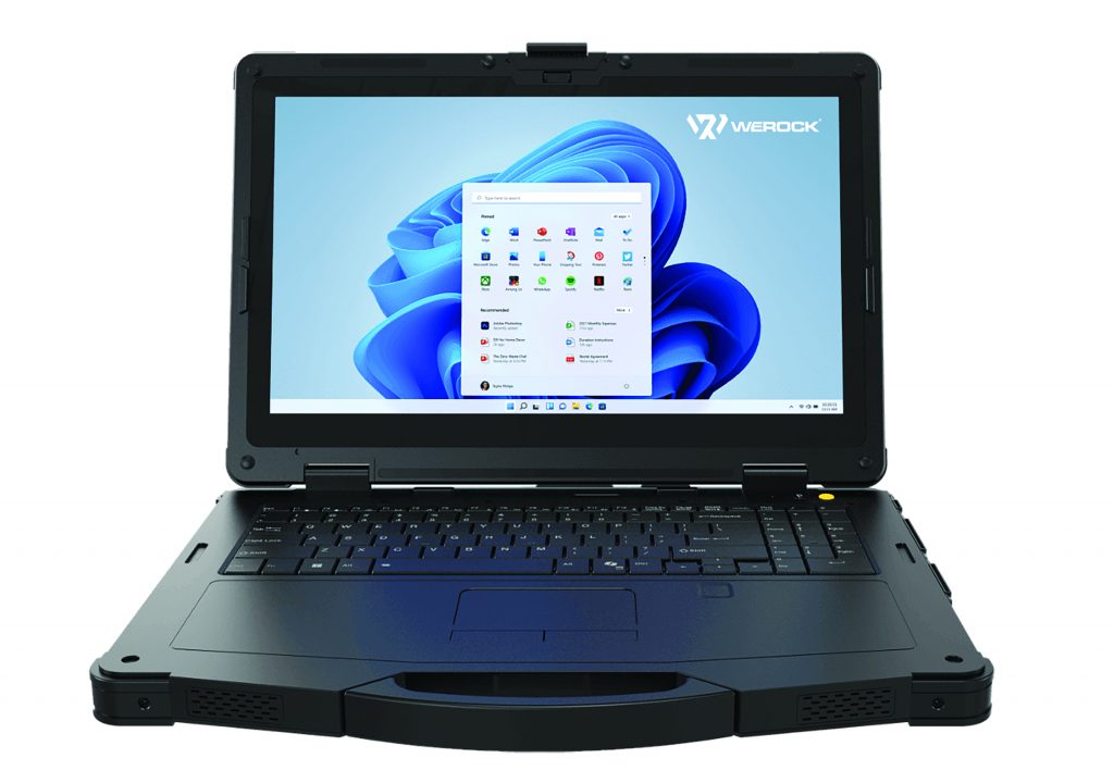 A rugged notebook computer with a durable, reinforced design, placed on a flat surface. The notebook is built to withstand harsh environments, featuring a sturdy exterior and robust components