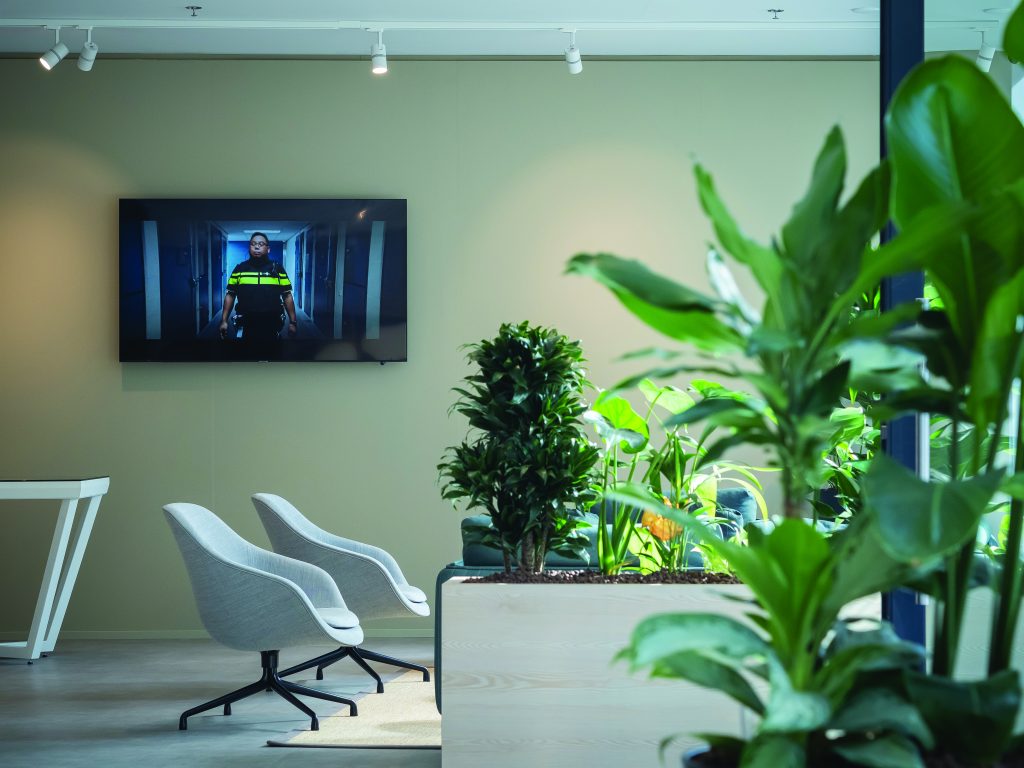 A modern building with large windows, featuring a clean and contemporary design. The building is part of a public safety operation setting, emphasizing the architectural style and environment.