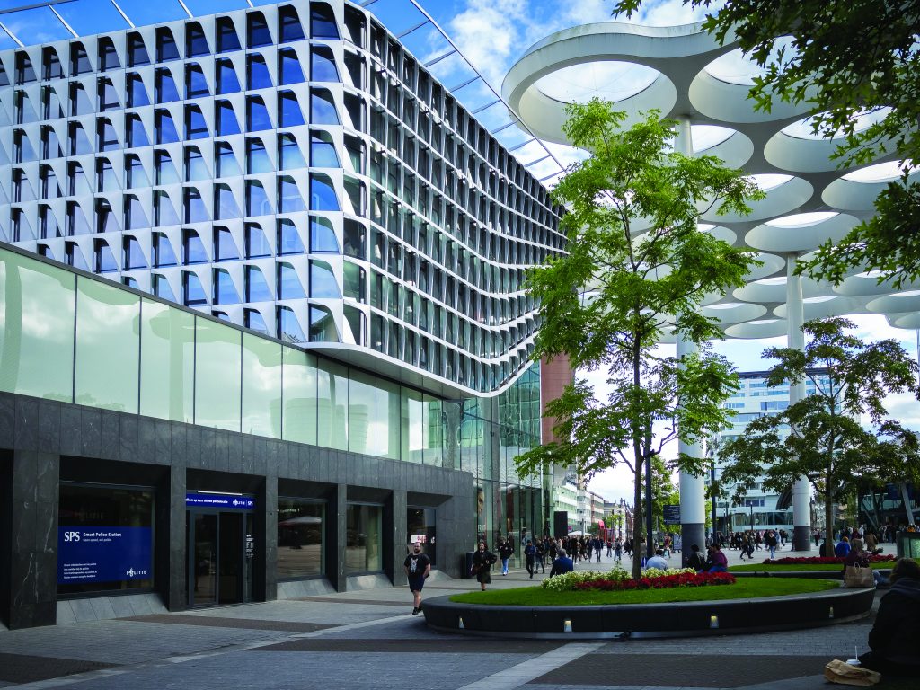 A modern building with large windows and a clean, contemporary design. The building is part of a public safety operation setting, highlighting its architectural style and environment.
