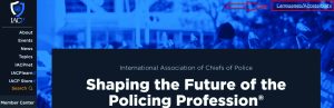 Screenshot of IACP site with blue background, sidebar menu, bold white text 'Shaping the Future of the Policing Profession,' red arrow to accessibility.