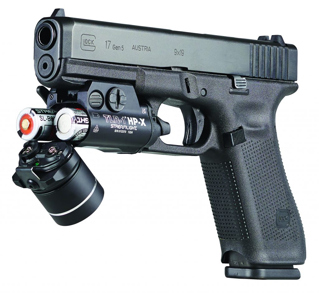 Close-up of black Streamlight TLR-1 HP-X tactical flashlight with rail mount, labeled 'TLR-1 HP-X STREAMLIGHT' and serial number SN#G21730 1224.