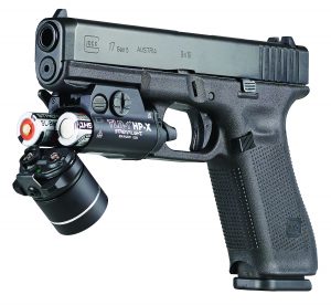 Close-up of black Streamlight TLR-1 HP-X tactical flashlight with rail mount, labeled 'TLR-1 HP-X STREAMLIGHT' and serial number SN#G21730 1224.