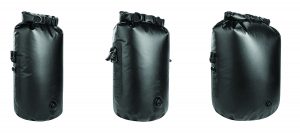 Three black waterproof dry bags with roll-top closures, buckles, and bottom air-release valves displayed side by side in small, medium, and large sizes