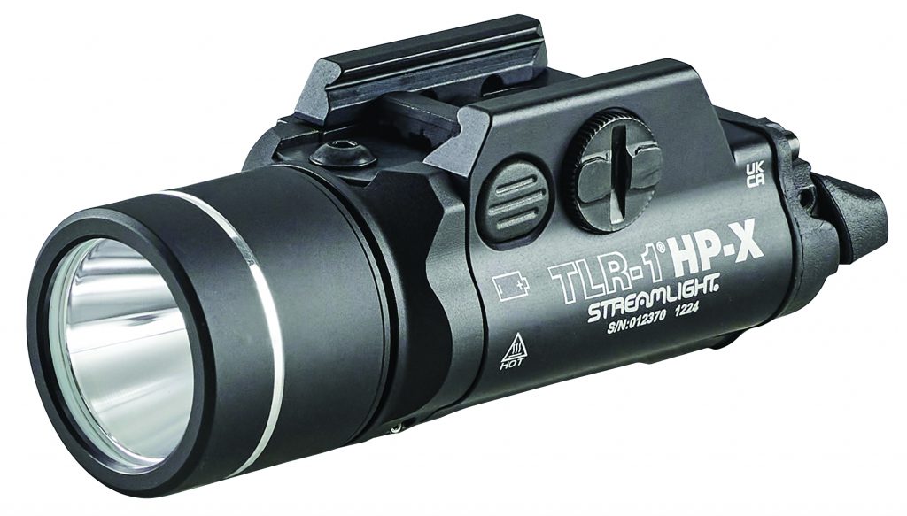 Close-up of black Streamlight TLR-1 HP-X tactical flashlight with mounting rail, serial 012370, and markings: 'HOT', 'UK CA', and model details
