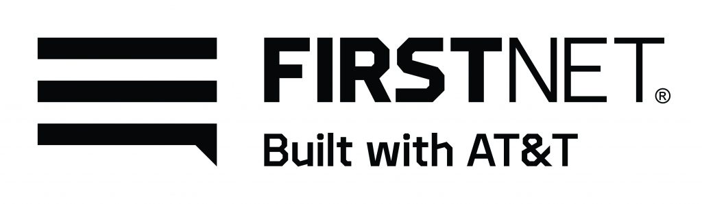The image shows the logo for FirstNet, which is built with AT&T. The logo consists of three horizontal lines stacked on top of each other to the left, resembling a stylized speech bubble or signal bars. To the right of these lines is the word "FIRSTNET" in bold, uppercase letters. Below "FIRSTNET," in smaller font, are the words "Built with AT&T." The entire logo is presented in grayscale.