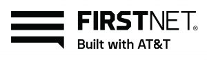 The image shows the logo for FirstNet, which is built with AT&T. The logo consists of three horizontal lines stacked on top of each other to the left, resembling a stylized speech bubble or signal bars. To the right of these lines is the word "FIRSTNET" in bold, uppercase letters. Below "FIRSTNET," in smaller font, are the words "Built with AT&T." The entire logo is presented in grayscale.